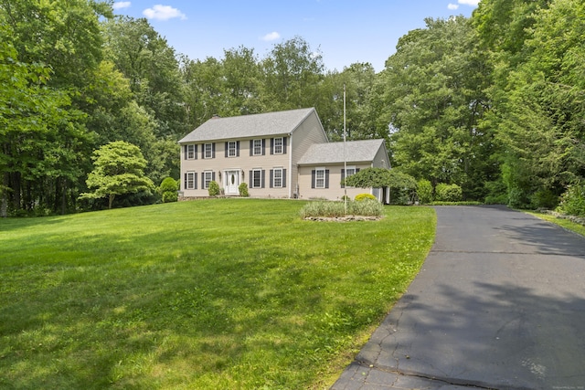 8 Stone Gate Dr, Newtown, CT 06482 - colonial-style house with a front yard and a wooded view