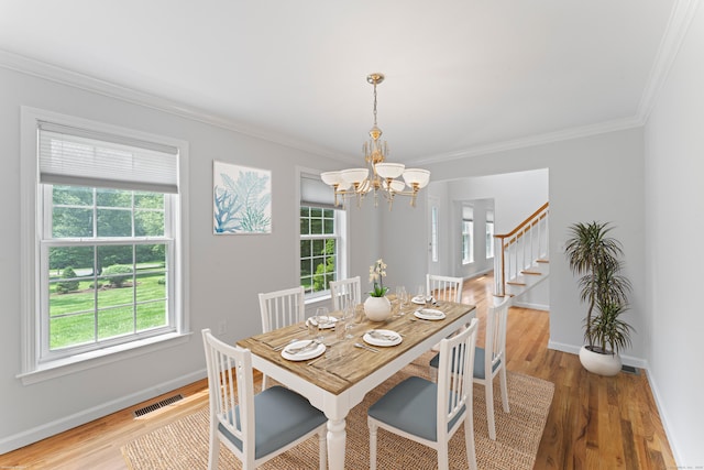 8 Stone Gate Dr, Newtown, CT 06482 - dining area featuring plenty of natural light, a chandelier, ornamental molding, and wood finished floors