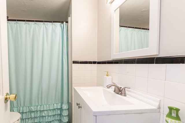 47 Yale St, Hartford, CT 06114 - full bathroom with vanity, tile walls, and a shower with curtain