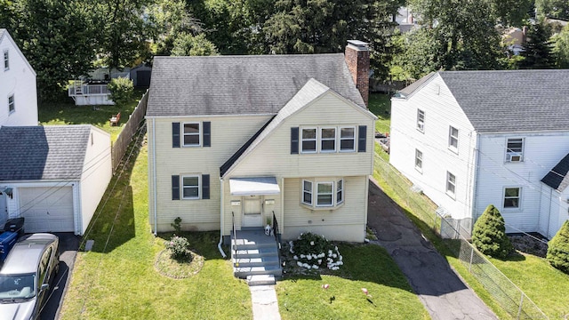 47 Yale St, Hartford, CT 06114 - view of front of house with a chimney, a garage, and cooling unit