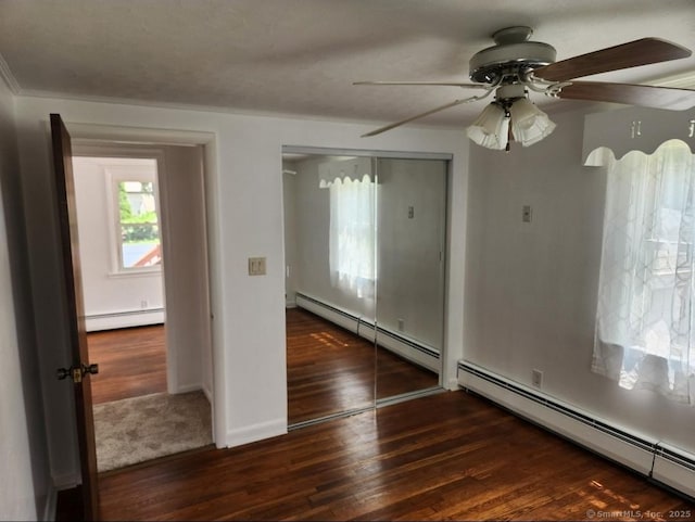 12 Hart Pl, Plainville, CT 06062 - spare room featuring a baseboard radiator and wood finished floors