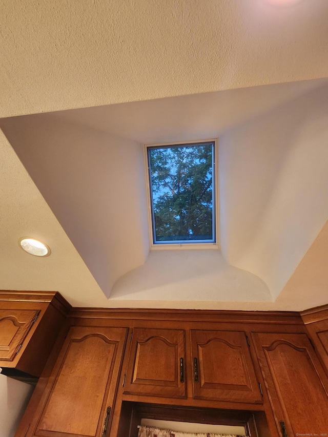 12 Hart Pl, Plainville, CT 06062 - detailed view of light countertops and brown cabinetry