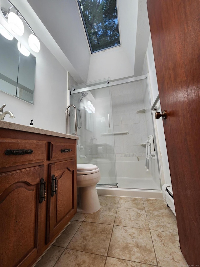 12 Hart Pl, Plainville, CT 06062 - bathroom featuring a skylight, vanity, a shower stall, tile patterned floors, and a baseboard heating unit