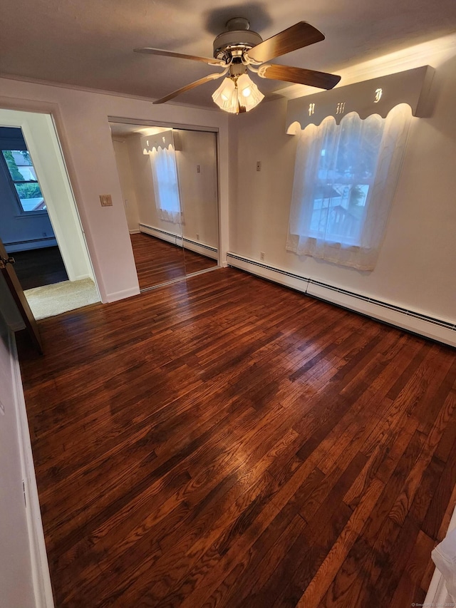 12 Hart Pl, Plainville, CT 06062 - spare room featuring a baseboard radiator, wood finished floors, and a ceiling fan