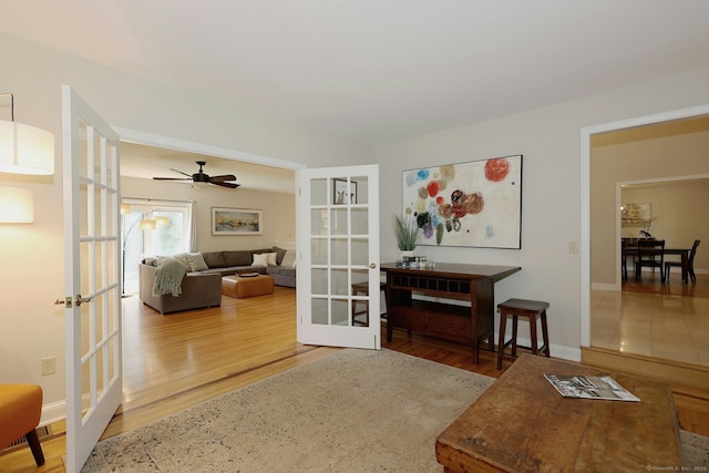 108 Northwood Dr, Easton, CT 06612 - living area featuring french doors, wood finished floors, and baseboards