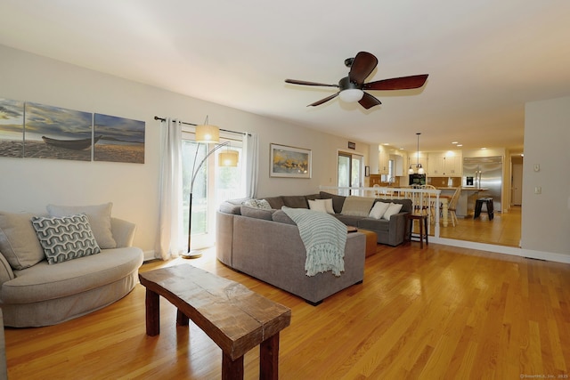 108 Northwood Dr, Easton, CT 06612 - living area with ceiling fan, light wood finished floors, and baseboards