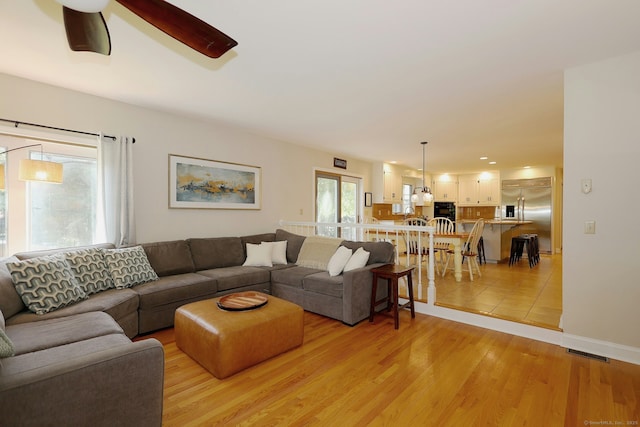 108 Northwood Dr, Easton, CT 06612 - living room with a ceiling fan, light wood finished floors, and baseboards