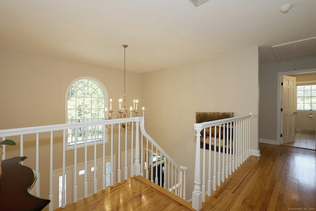 108 Northwood Dr, Easton, CT 06612 - staircase with attic access, wood finished floors, baseboards, and a chandelier