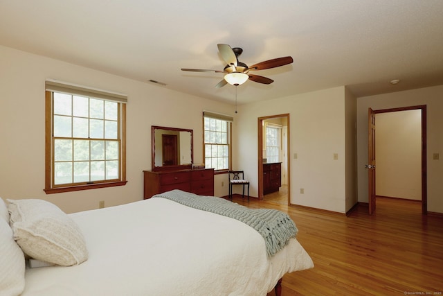 108 Northwood Dr, Easton, CT 06612 - bedroom with light wood-type flooring, baseboards, a ceiling fan, and connected bathroom
