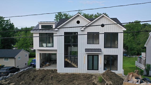 20 N Lake Shore Dr, Brookfield, CT 06804 - view of front of house featuring board and batten siding, a standing seam roof, metal roof, and a patio area