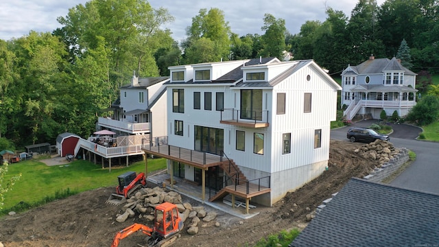 20 N Lake Shore Dr, Brookfield, CT 06804 - view of front of home featuring stairs, a balcony, metal roof, and a deck