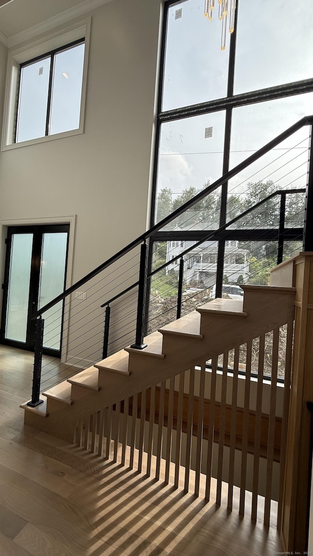 20 N Lake Shore Dr, Brookfield, CT 06804 - stairs featuring healthy amount of natural light and a chandelier