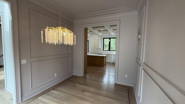20 N Lake Shore Dr, Brookfield, CT 06804 - hallway featuring ornamental molding, coffered ceiling, light wood-style flooring, a chandelier, and beamed ceiling