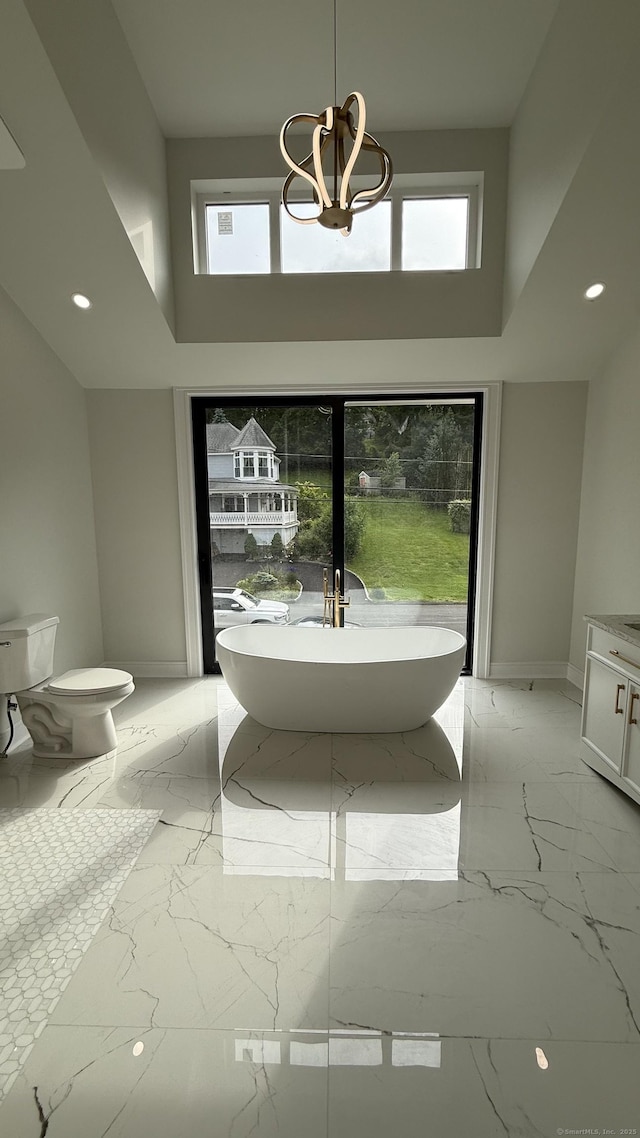 20 N Lake Shore Dr, Brookfield, CT 06804 - full bathroom featuring marble tiled flooring, a high ceiling, a soaking tub, and recessed lighting