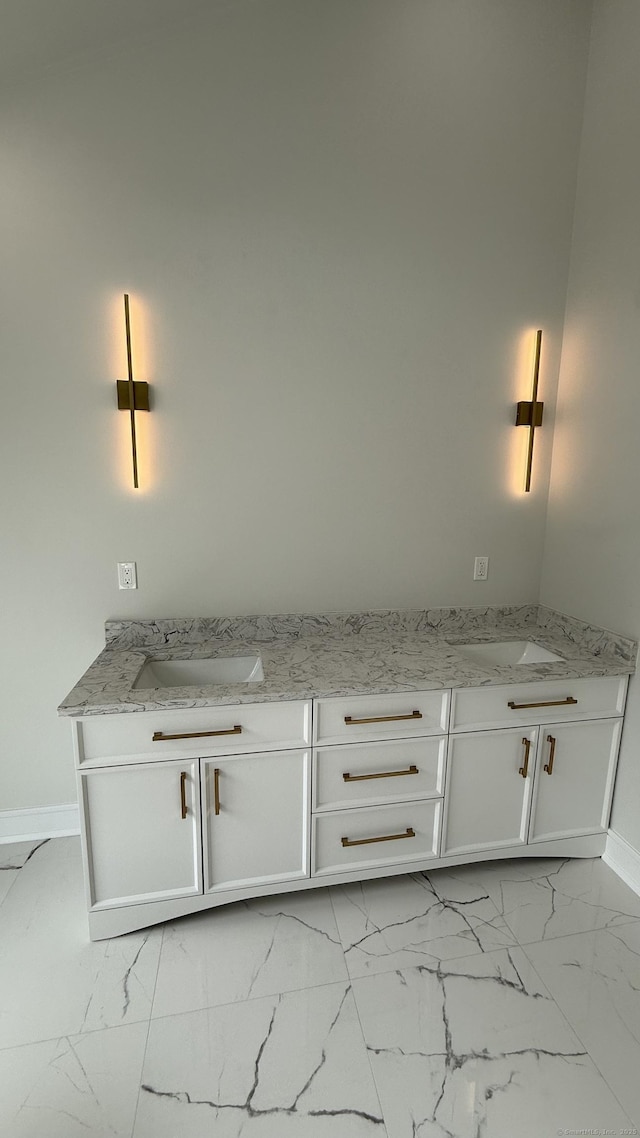 20 N Lake Shore Dr, Brookfield, CT 06804 - bathroom with double vanity, baseboards, and marble finish floors