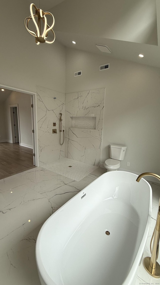 20 N Lake Shore Dr, Brookfield, CT 06804 - bathroom with vaulted ceiling, recessed lighting, a marble finish shower, a freestanding bath, and marble finish flooring