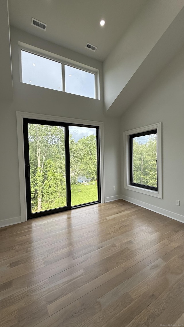 20 N Lake Shore Dr, Brookfield, CT 06804 - unfurnished room featuring a high ceiling, baseboards, wood finished floors, and recessed lighting