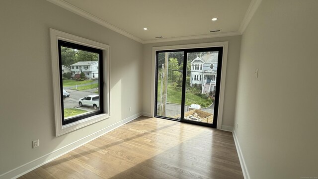 20 N Lake Shore Dr, Brookfield, CT 06804 - spare room with healthy amount of natural light, ornamental molding, wood finished floors, baseboards, and recessed lighting