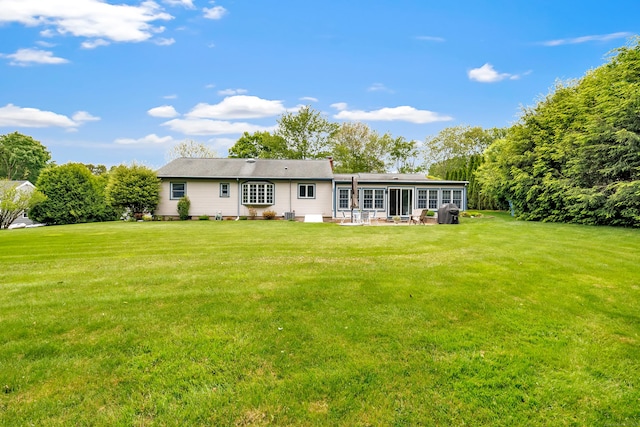 131 Ridgeview Ave, Trumbull, CT 06611 - back of house featuring a lawn and a patio area