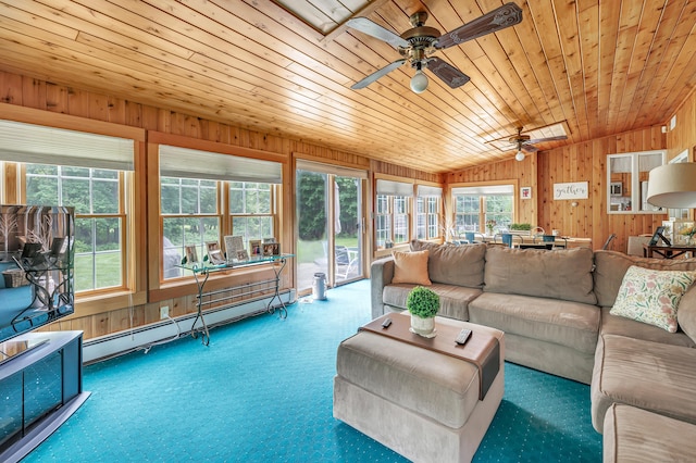 131 Ridgeview Ave, Trumbull, CT 06611 - living room featuring wood walls, vaulted ceiling, ceiling fan, a baseboard radiator, and carpet floors