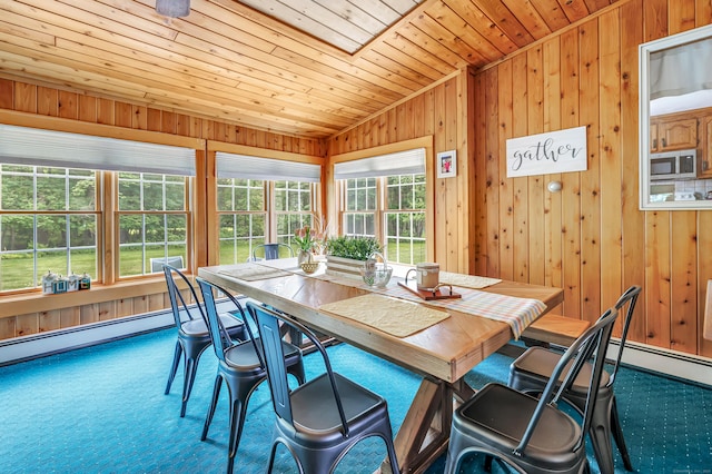 131 Ridgeview Ave, Trumbull, CT 06611 - dining area featuring wood ceiling, wood walls, carpet floors, a baseboard radiator, and a skylight