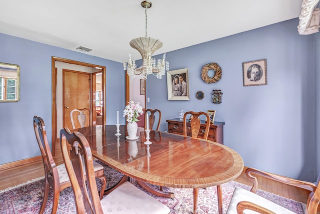 131 Ridgeview Ave, Trumbull, CT 06611 - dining room with a chandelier and wood finished floors