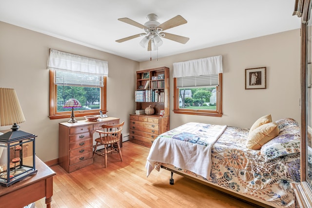 131 Ridgeview Ave, Trumbull, CT 06611 - bedroom with multiple windows, light wood-style flooring, baseboard heating, and ceiling fan