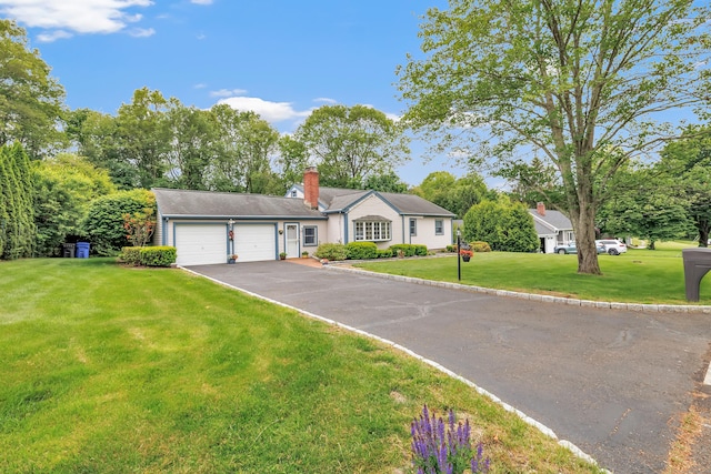 131 Ridgeview Ave, Trumbull, CT 06611 - ranch-style house featuring an attached garage, asphalt driveway, a front lawn, and a chimney