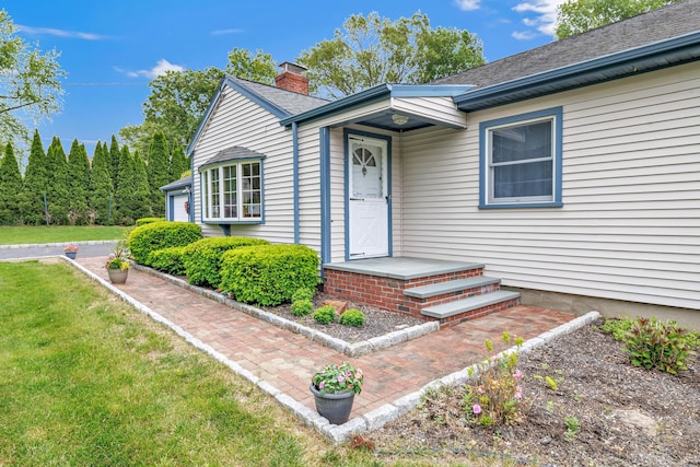 131 Ridgeview Ave, Trumbull, CT 06611 - property entrance with a chimney and a lawn