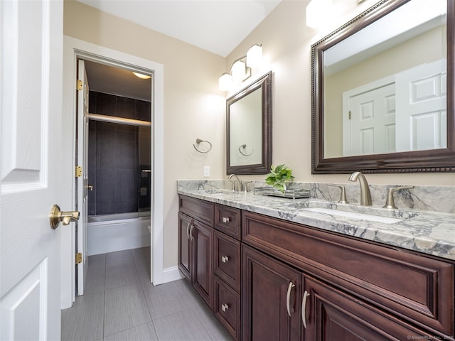 10 Wilton Hls Unit 10, Wilton, CT 06897 - bathroom with double vanity, tile patterned floors, washtub / shower combination, and baseboards