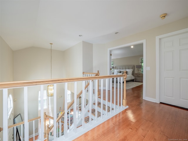 10 Wilton Hls Unit 10, Wilton, CT 06897 - hall featuring a chandelier, wood finished floors, an upstairs landing, vaulted ceiling, and recessed lighting