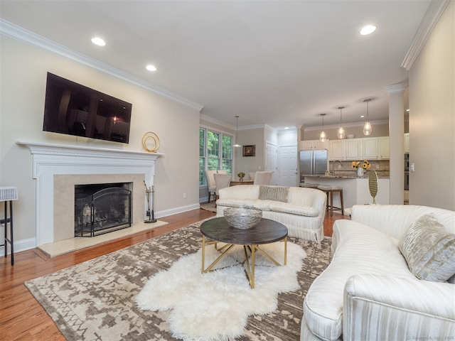 10 Wilton Hls Unit 10, Wilton, CT 06897 - living room with wood finished floors, recessed lighting, baseboards, crown molding, and a fireplace
