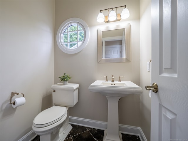 10 Wilton Hls Unit 10, Wilton, CT 06897 - half bath with baseboards, toilet, and marble look tile flooring