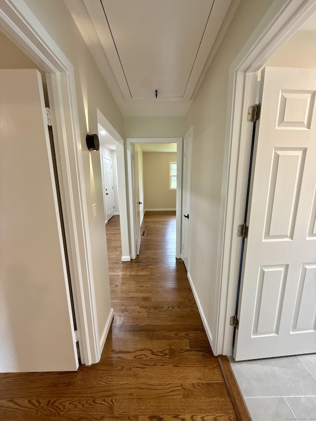 9 Grieb Rd, Wallingford, CT 06492 - hallway featuring attic access, wood finished floors, and baseboards