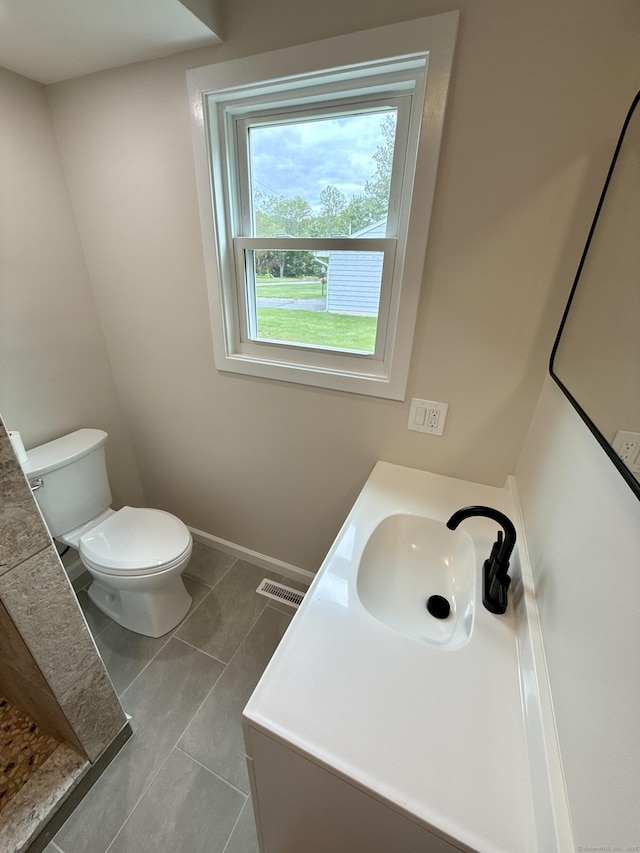 9 Grieb Rd, Wallingford, CT 06492 - bathroom with vanity, toilet, and baseboards