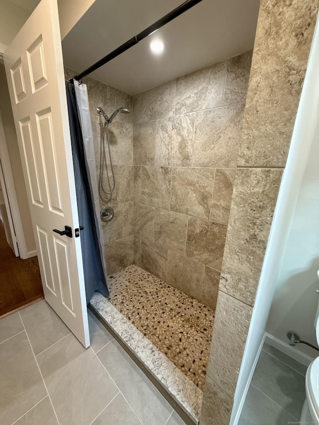 9 Grieb Rd, Wallingford, CT 06492 - bathroom with a tile shower, toilet, and tile patterned flooring