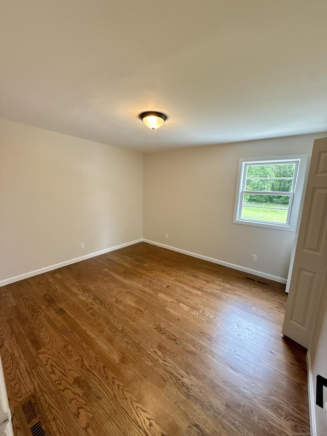 9 Grieb Rd, Wallingford, CT 06492 - spare room with dark wood-type flooring and baseboards