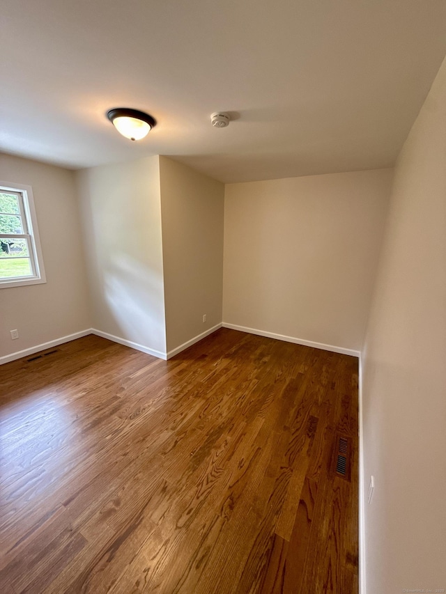 9 Grieb Rd, Wallingford, CT 06492 - spare room featuring wood finished floors, a smoke detector, and baseboards