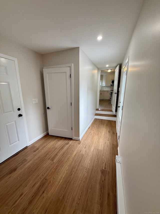9 Grieb Rd, Wallingford, CT 06492 - corridor with wood finished floors, baseboards, and recessed lighting