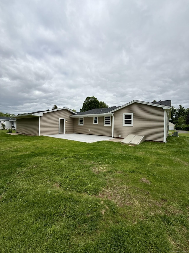 9 Grieb Rd, Wallingford, CT 06492 - back of property with a patio and a lawn