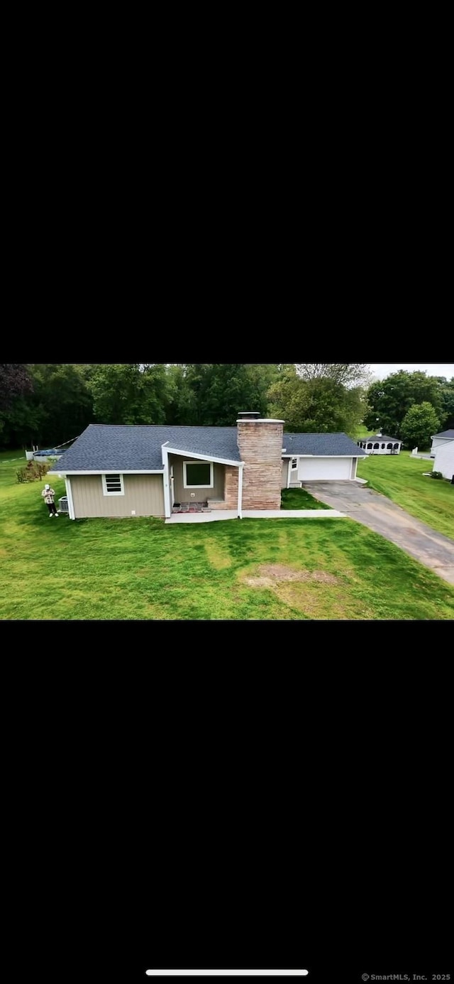 9 Grieb Rd, Wallingford, CT 06492 - ranch-style home with a front yard, asphalt driveway, and a garage