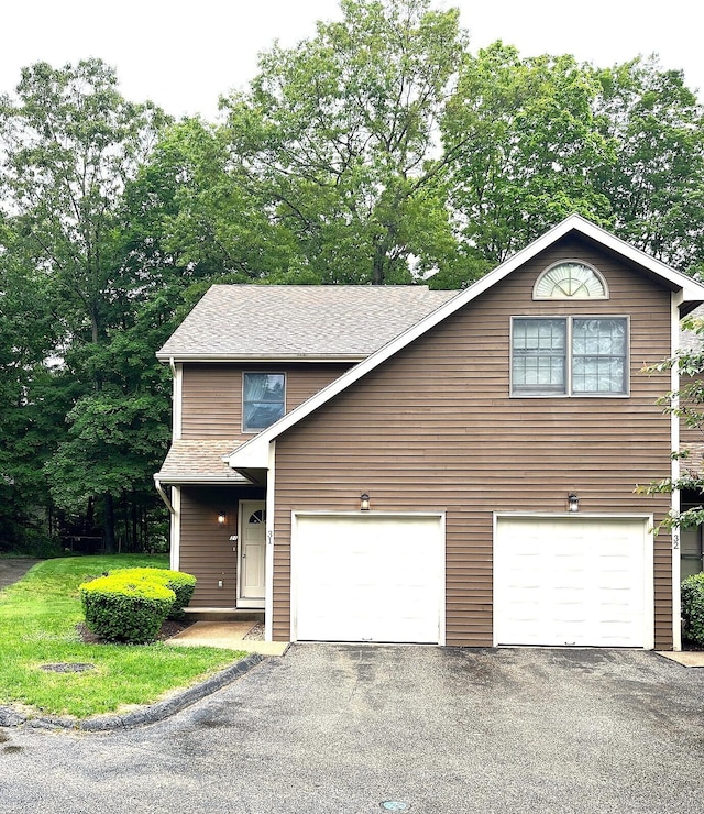 366 Ash St # 31, Windham, CT 06226 - view of front of house featuring asphalt driveway, a shingled roof, and an attached garage