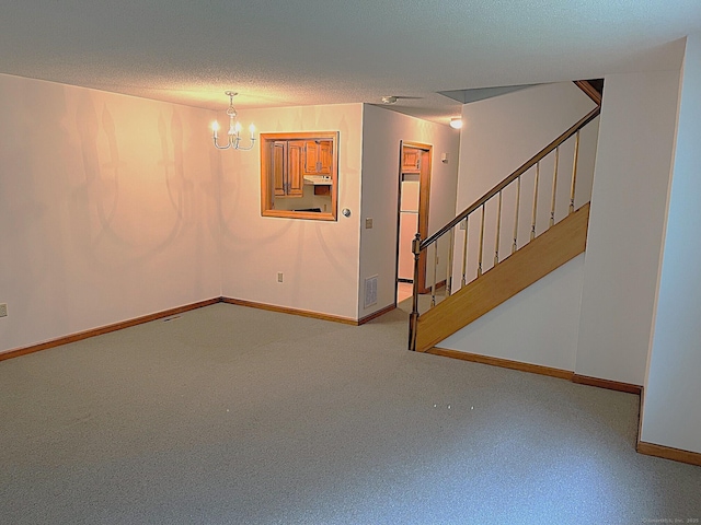 366 Ash St # 31, Windham, CT 06226 - unfurnished living room featuring a chandelier, stairs, baseboards, and a textured ceiling