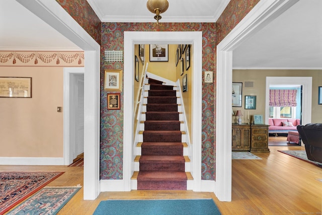 73 Hemlock Rd, New Haven, CT 06515 - stairs with wallpapered walls, wood finished floors, and ornamental molding