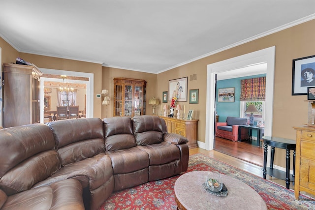 73 Hemlock Rd, New Haven, CT 06515 - living room with wood finished floors, plenty of natural light, crown molding, and a chandelier