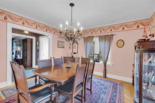 73 Hemlock Rd, New Haven, CT 06515 - dining area featuring a chandelier, light wood-style floors, and ornamental molding