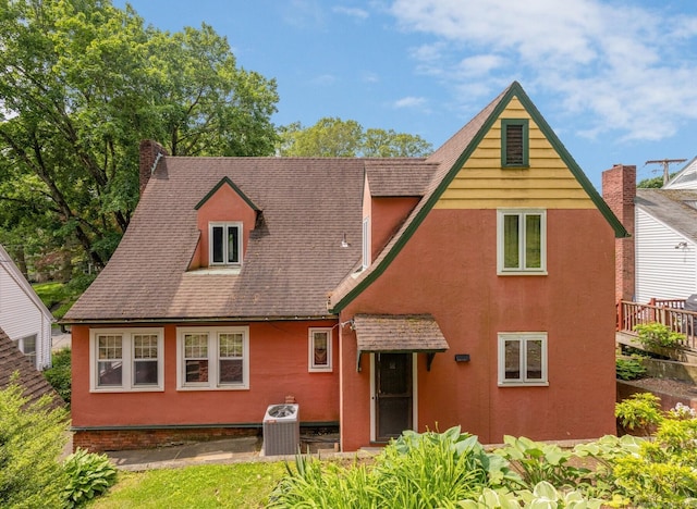 73 Hemlock Rd, New Haven, CT 06515 - rear view of house with a chimney, stucco siding, and a shingled roof