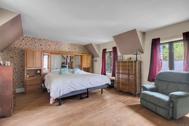 73 Hemlock Rd, New Haven, CT 06515 - bedroom featuring wallpapered walls, multiple windows, and light wood-style flooring