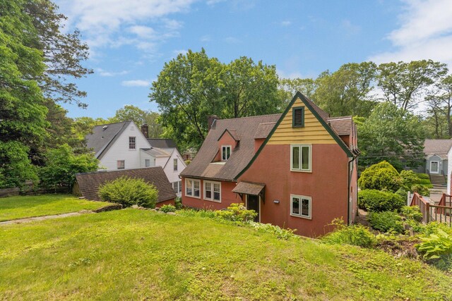 73 Hemlock Rd, New Haven, CT 06515 - view of front of house with a front yard and stucco siding