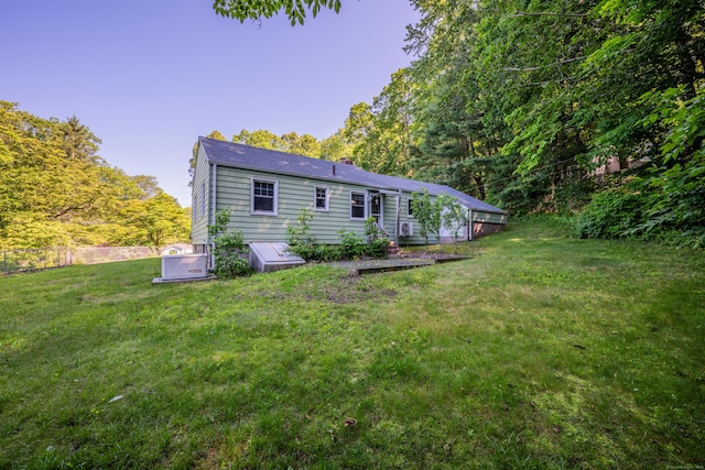 272 Bell St, Glastonbury, CT 06033 - back of property featuring a lawn and a chimney